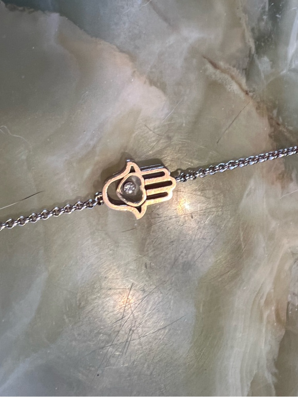 Chopard Hamsa Hand Pendant Bracelet in Rose gold with floating diamond.